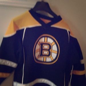 Bruins sweater, black pants